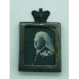 A miniature silver picture frame of Queen Victoria