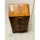A Small four drawer bow fronted bureau