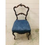 A Hallway chair with cabriole legs and ornate back