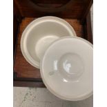 An mahogany commode with original bowl