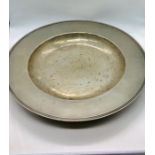A Large white metal hammered bowl ( diam 43cm)