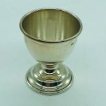 A hallmarked silver egg cup