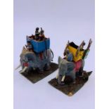 Two Vintage diecast elephants with Howdah and passengers.