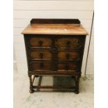 A Jacobean style oak three drawer chest of drawers on barley twist legs