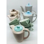 A selection of Poole Pottery tea pots, coffee pots and cups.