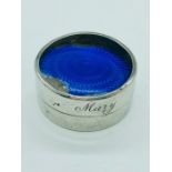 A silver pill box with enamel top AF