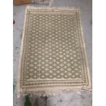 A hand knotted Turkish green rug
