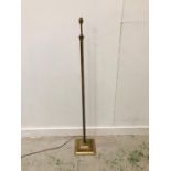 A Solid brass floor lamp with decorative square base