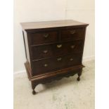 A Two over two chest of drawers on stand with further drawer under (H110cm D53cm W97cm)