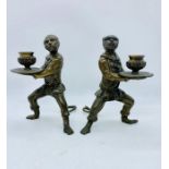 A Pair of Grand Tour Bronze Monkey candlesticks