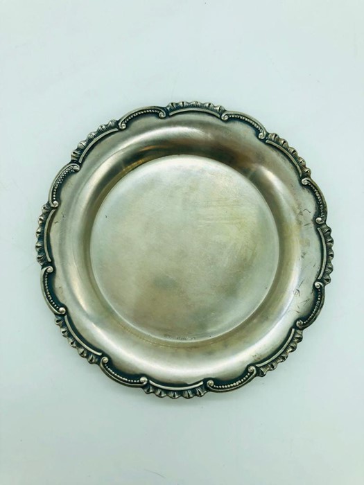 A single Swedish silver coaster