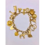 A 9ct gold charm bracelet (31.5g)