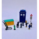 A selection of lead figures, Dinky Toy signals and a Police Box