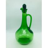 A Green glass decanter with stopper
