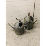 Two vintage watering cans