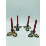 A Set of four Danish Christmas silver plate candle holders