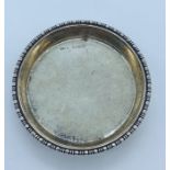 A small silver pin dish