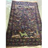 An hand knotted Turkish rug with woodland theme with blue grounds