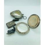 A small selection of white metal items to include purse, vesta, compact etc.
