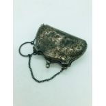 A small silk lined silver purse Birmingham hallmarked