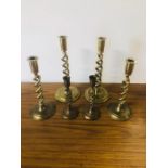 Three pairs of twisted brass candle sticks