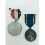 Two medals celebrating the Coronation of King George VI
