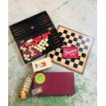 A Selection of vintage board games to include a set of ivory/bone draughts pieces and carved