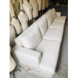 A Large four seater cream fabric sofa (W353cm D100cm H83cm)