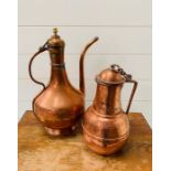 A Copper ewer Persian pitcher coffee pot and a copper handled pitcher