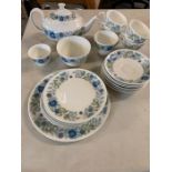 A Wedgwood "Clementine" part tea set in white with blue flower