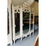 A Large hand painted ornate antique wardrobe on stand with three mirrored doors and hanging