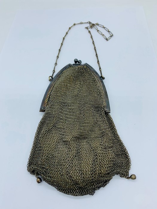 A silver mesh, silk lined ladies purse