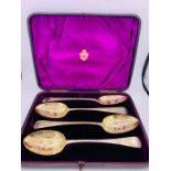 A boxed set of four Georgian silver serving spoons