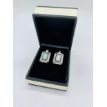 A Pair of silver cz and opal earrings