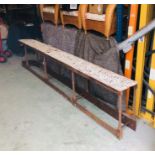 A Long cast iron Victorian potting shelf on base (H70cm W330cm D33cm)