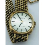 A Ladies 9ct gold Tissot watch (19g)