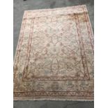 A hand knotted Turkish rug beige with red and blue vine leaves (170cm X 230cm)