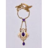 A 9ct gold and amethyst pendant on matching gold chain (4.1g)