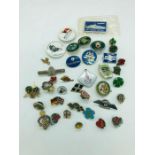 A Selection of enamel badges and pins