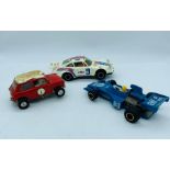 Three scalextric vehicles