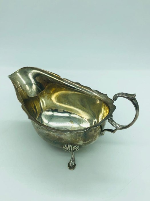 A Birmingham hallmarked silver sauce boat EWH makers mark.