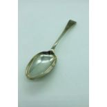 A silver serving spoon hallmarked 1907, makers mark JR.