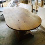 A Long oval oak dining table with double spherical pedestal base (W270cm D140cm H77cm)