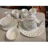 A Wedgwood six piece tea set, in white with flower decoration