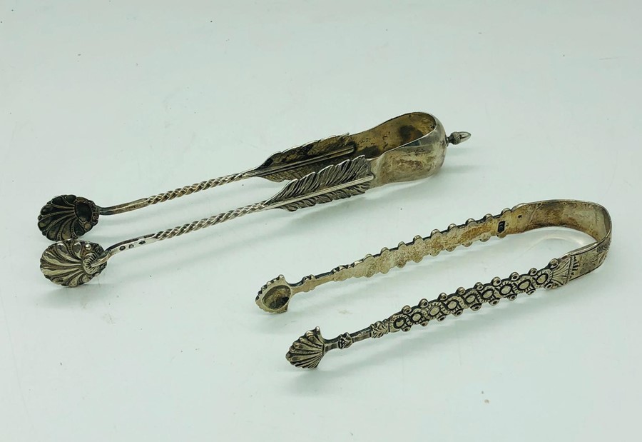 Two pairs of Continental silver sugar nips