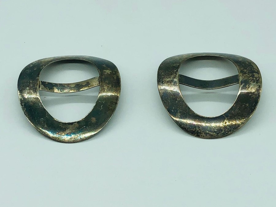 A pair of Chinese silver buckles