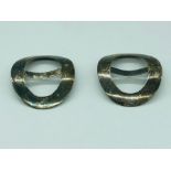 A pair of Chinese silver buckles