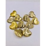 Eleven Variety Club Gold Heart brooches.