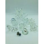 A Selection of crystal glass ornaments to include a starburst candlestick