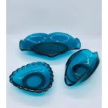 Three pieces of decorative art glass in turquoise blue